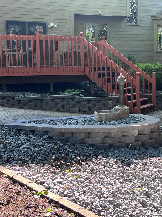 Finished backyard makeover and fountain restoration by Elzo Landscape in Elk River Minnesota