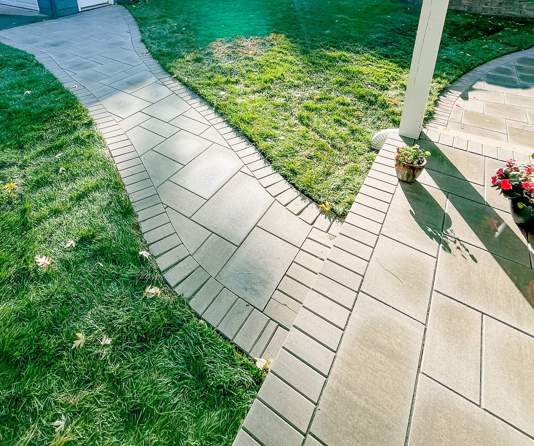 Finished custom paver patio and walkway in Cedar Lake Minneapolis backyard renovation by Elzo Landscape